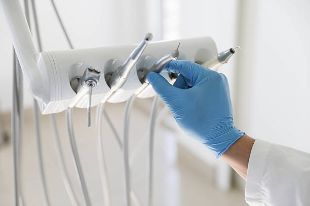 Professional Root Canal Treatment technician working in Scottville, MI